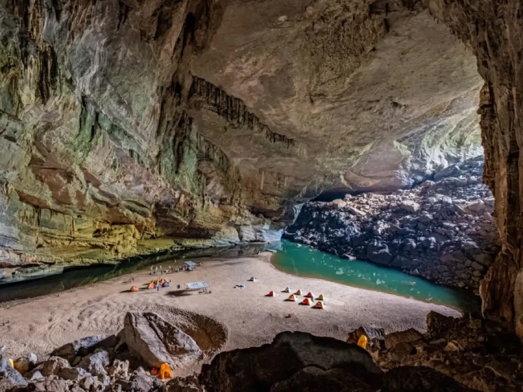 Tents sit on a beach in Hang En cave in Vietnam