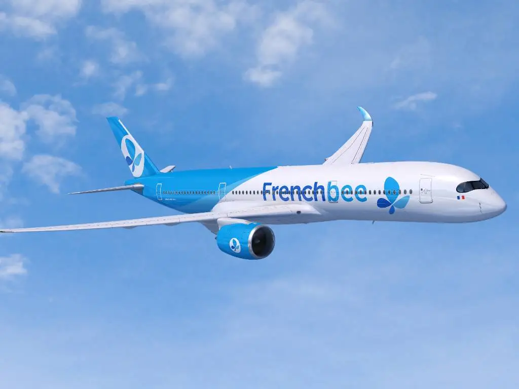 a French bee plane in the sky.